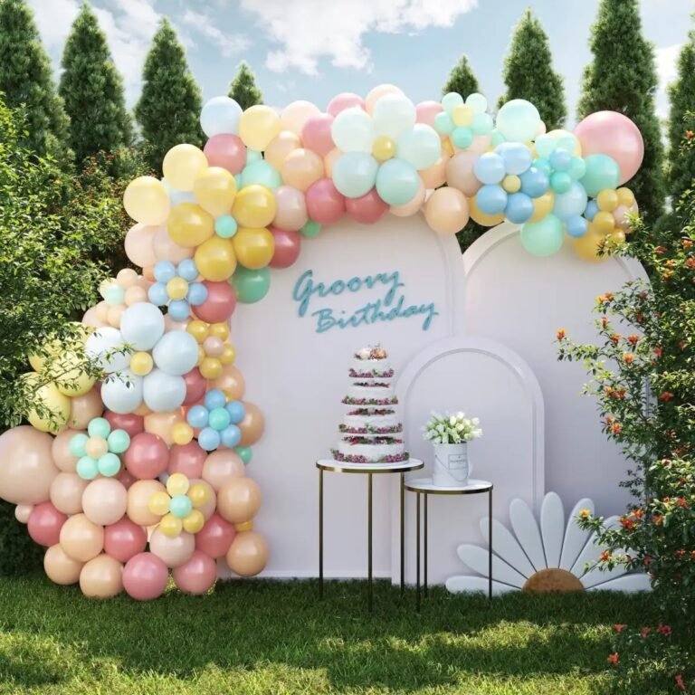 It's a beautiful outdoor birthday scene decoration with a colorful balloon arch